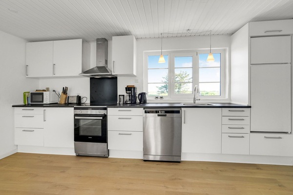 Fridge, stovetop, dishwasher, coffee/tea maker