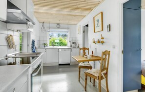 Fridge, stovetop, dishwasher, coffee/tea maker