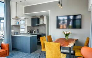 Fridge, stovetop, dishwasher, coffee/tea maker
