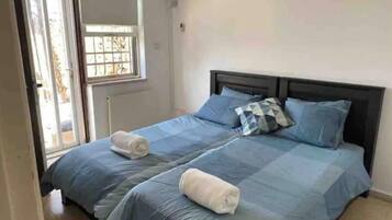 1 bedroom, desk, iron/ironing board, travel crib