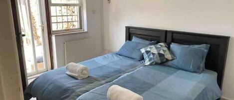 1 bedroom, desk, iron/ironing board, travel crib