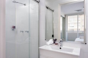 Shower, hair dryer, towels, soap