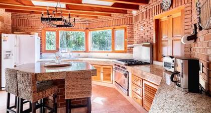 Mexican house in forest with lake view and pool.