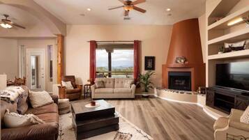 Smart TV, fireplace, books, stereo