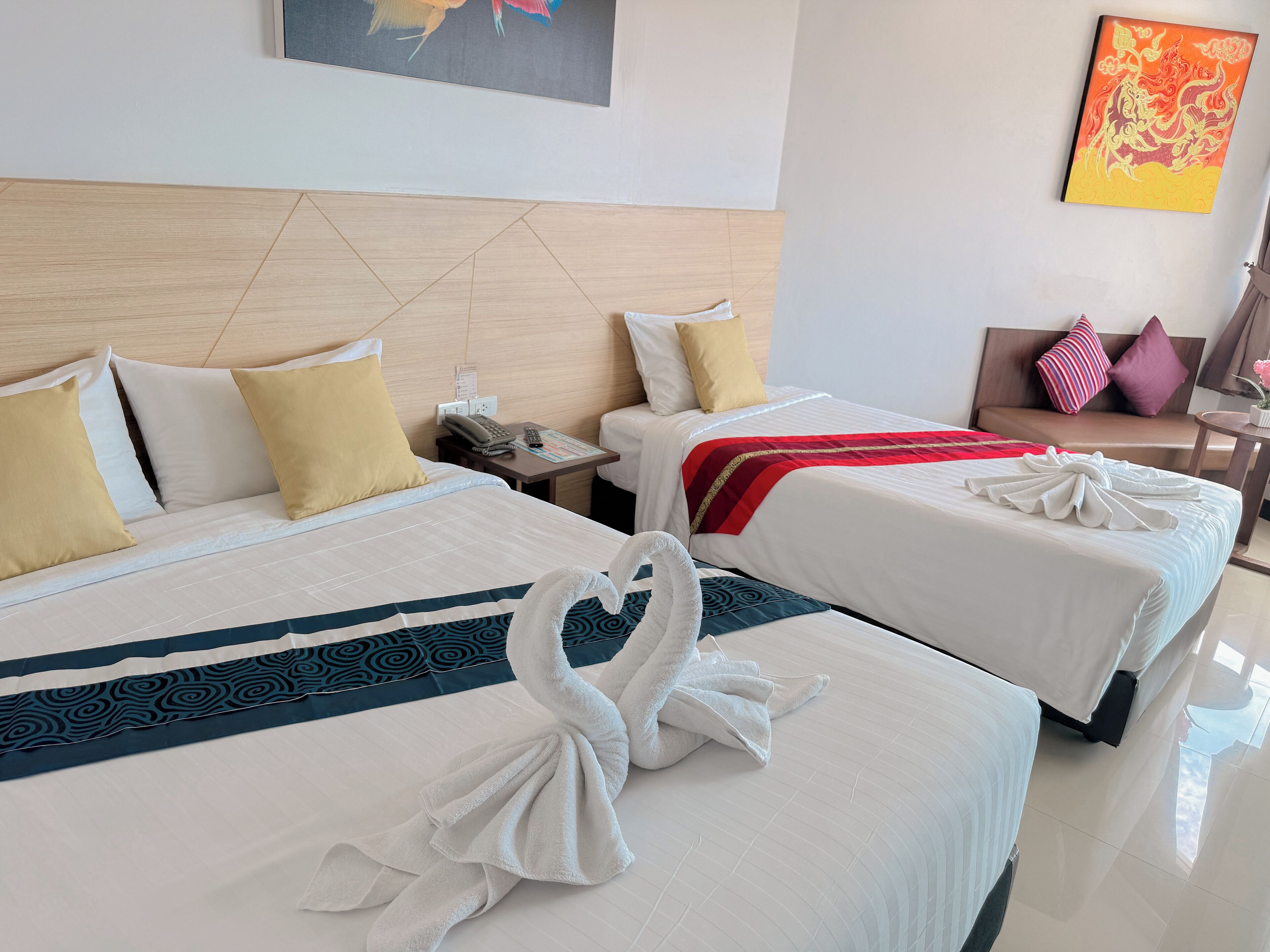 Deluxe Triple Room, Bathtub | In-room safe, individually decorated, desk, laptop workspace