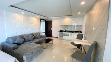 Family Quadruple Room, Bathtub, Tower | Living area
