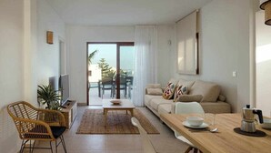 Un salon moderne avec un canapé, une table basse et une table à manger. On y trouve également un téléviseur, une plante et une vue sur l’extérieur.