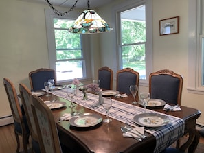 The dining room seats 8 with china and serving pieces for entertaining.