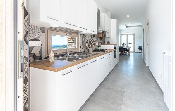 Fridge, stovetop, dishwasher, coffee/tea maker