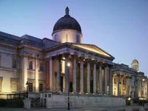 A classical building with a prominent dome and columns, likely a government or historical building. - Livestay - Hidden Covent Garden Gem (London)