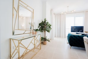 Executive Apartment | Living area | 55-inch flat-screen TV with cable channels, TV