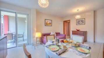 Family Apartment, Multiple Bedrooms (Casa Margherita Few Minutes From Lake) | Living room | 21-inch flat-screen TV with cable channels, TV