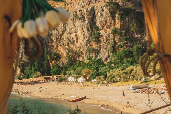 On the beach, white sand, sun loungers, beach umbrellas