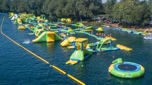 A water park with inflatable play structures and boats. - Livestay - One Bed Apt, Free Parking, Sleeps 4 (Slough)