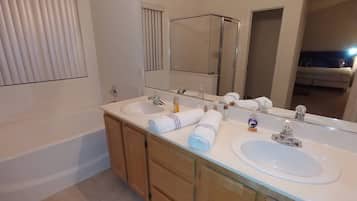 Bathtub, hair dryer, towels