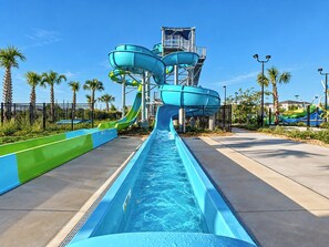 A water park with multiple slides and a pool. - Reunion Resort Condo: Waterpark, Clubhouses and fun! (Four Corners)