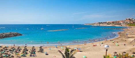 On the beach, sun loungers