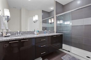 Combined shower/tub, hair dryer, towels, soap