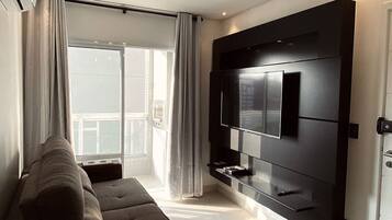 Deluxe Apartment | Living area | 55-inch Smart TV with digital channels, TV, Netflix