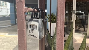 A metal gate with a padlock and a number "2" on it.
