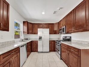 Private kitchen - Tranquil Escape: Serene 4BR Home w/Private Pool, Games & BBQ in Fort Lauderdale! (Fort Lauderdale)