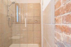 Shower, hair dryer, towels, shampoo