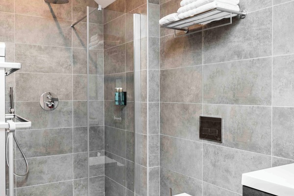 Shower, rainfall showerhead, hair dryer, towels
