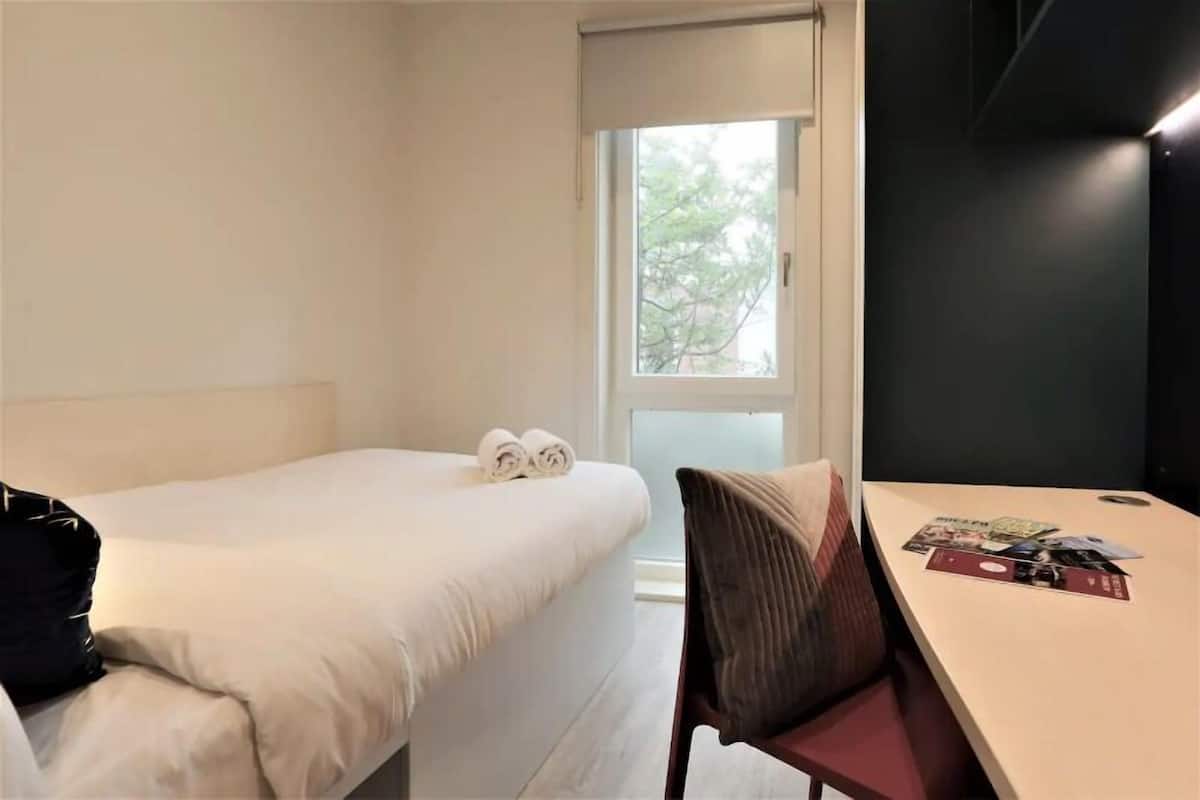 Desk, laptop workspace, free WiFi, bed sheets