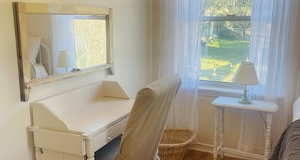 Downtown Cottage Style Home! Vintage vibes and comfortable amenities.