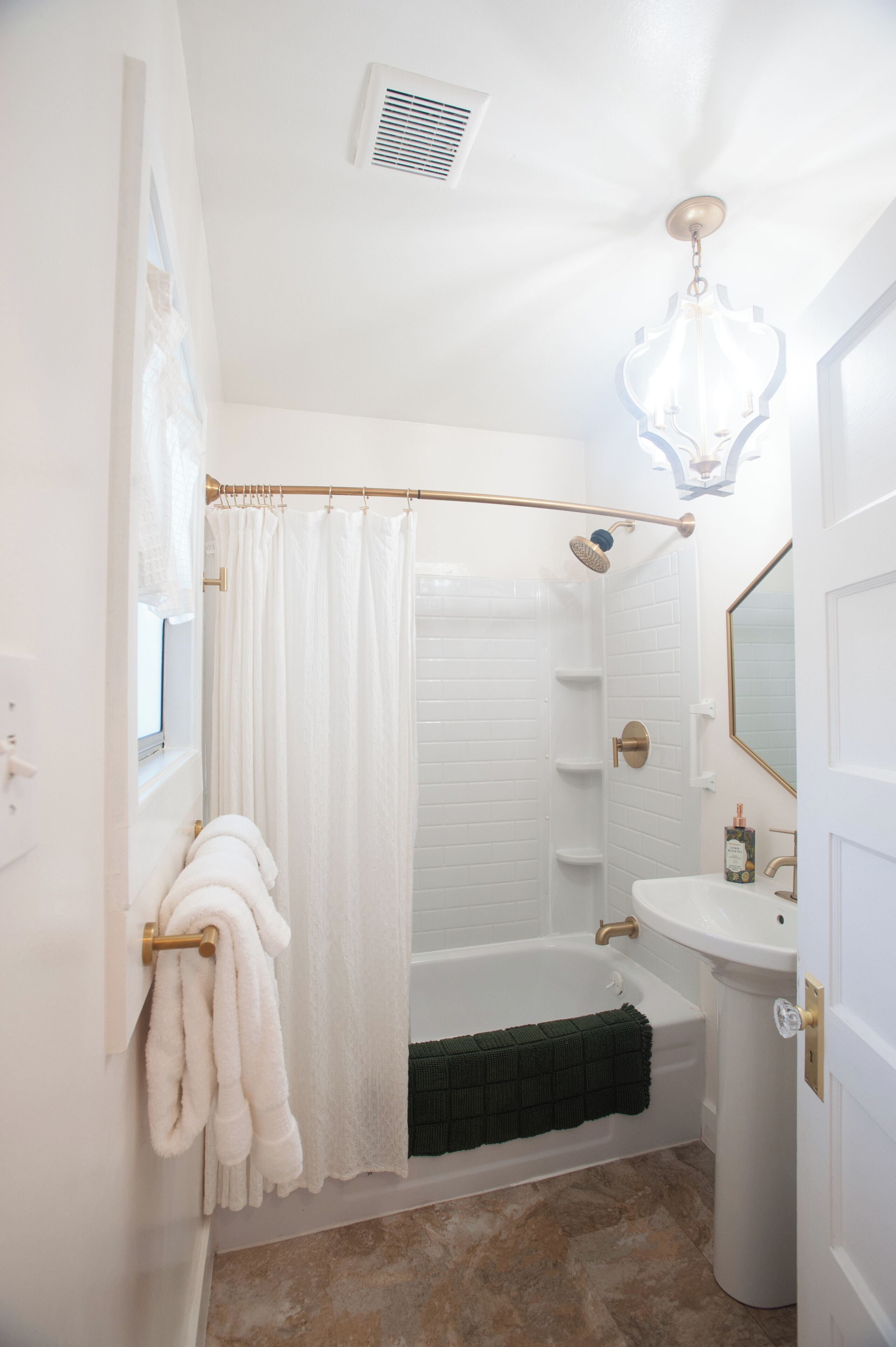 Bathtub, hair dryer, towels, soap