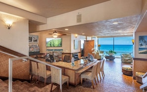 Experience the grandeur of our lobby, featuring a stunning ocean view, a central reception desk, and comfortable seating areas.