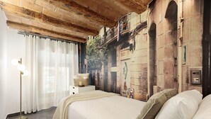 A bedroom with a bed, a floor lamp, and a wall mural. - OLA LIVING MACBA 0 (Barcelona)