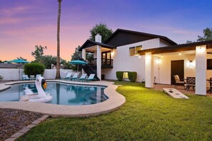 A heated pool, pool loungers