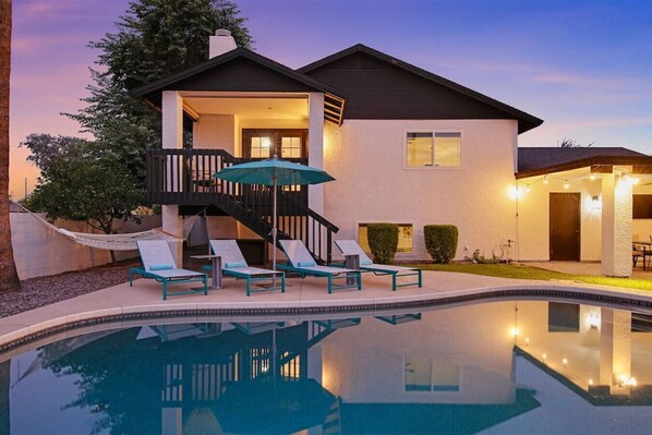 A heated pool, sun loungers