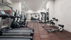 A modern gym with treadmills, elliptical machines, and weightlifting equipment. - Ramada Plaza BY Wyndham Ordu (Ordu)