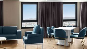 Suite, 1 King Bed, Smoking | Minibar, in-room safe, desk, laptop workspace