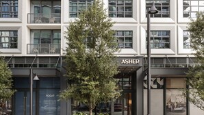 A modern building with a storefront labeled "ASHER" and a visible entrance. - ROOST Tampa (Tampa)