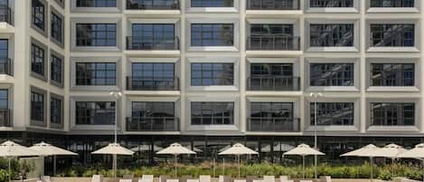 Outdoor pool, open 7:00 AM to 7:00 PM, free cabanas, pool umbrellas