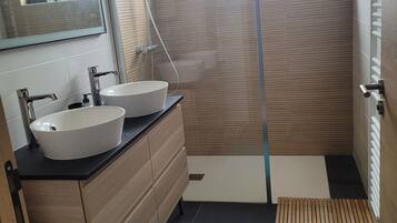 Bathtub, hair dryer, towels, soap
