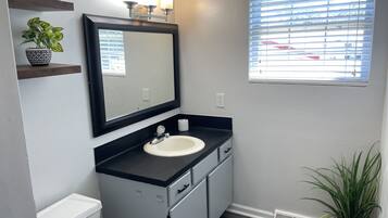 Bathtub, towels, toilet paper