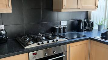 Coffee/tea maker, fridge, microwave, oven