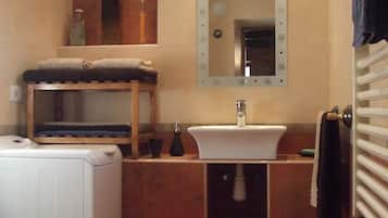 Shower, hair dryer, towels, toilet paper