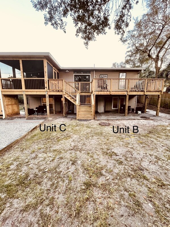 A two-story building with a covered patio area labeled 'Unit C' and 'Unit B'. - Unit B, Spirit of Folly, Pet Friendly, 2 short blocks - 100 yards - to the beach (Folly Beach)