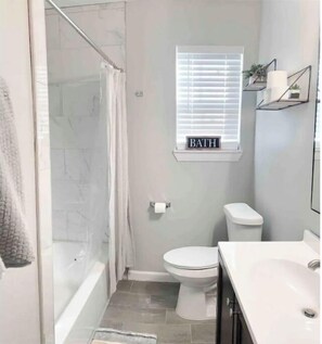 Combined shower/tub, hair dryer, towels, soap