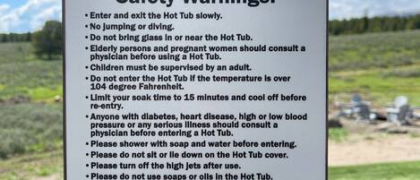 A safety warning sign for a hot tub.