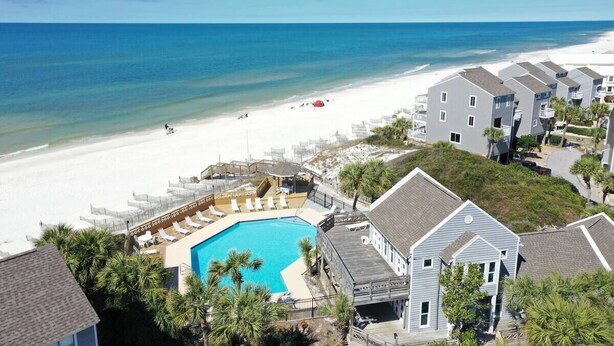 A beachfront hotel with a swimming pool, beach access, and multiple-story buildings. - CapeSanBlas Bright, End Unit •Short walk to neighborhood private beach •2 Pools  (Port St. Joe)
