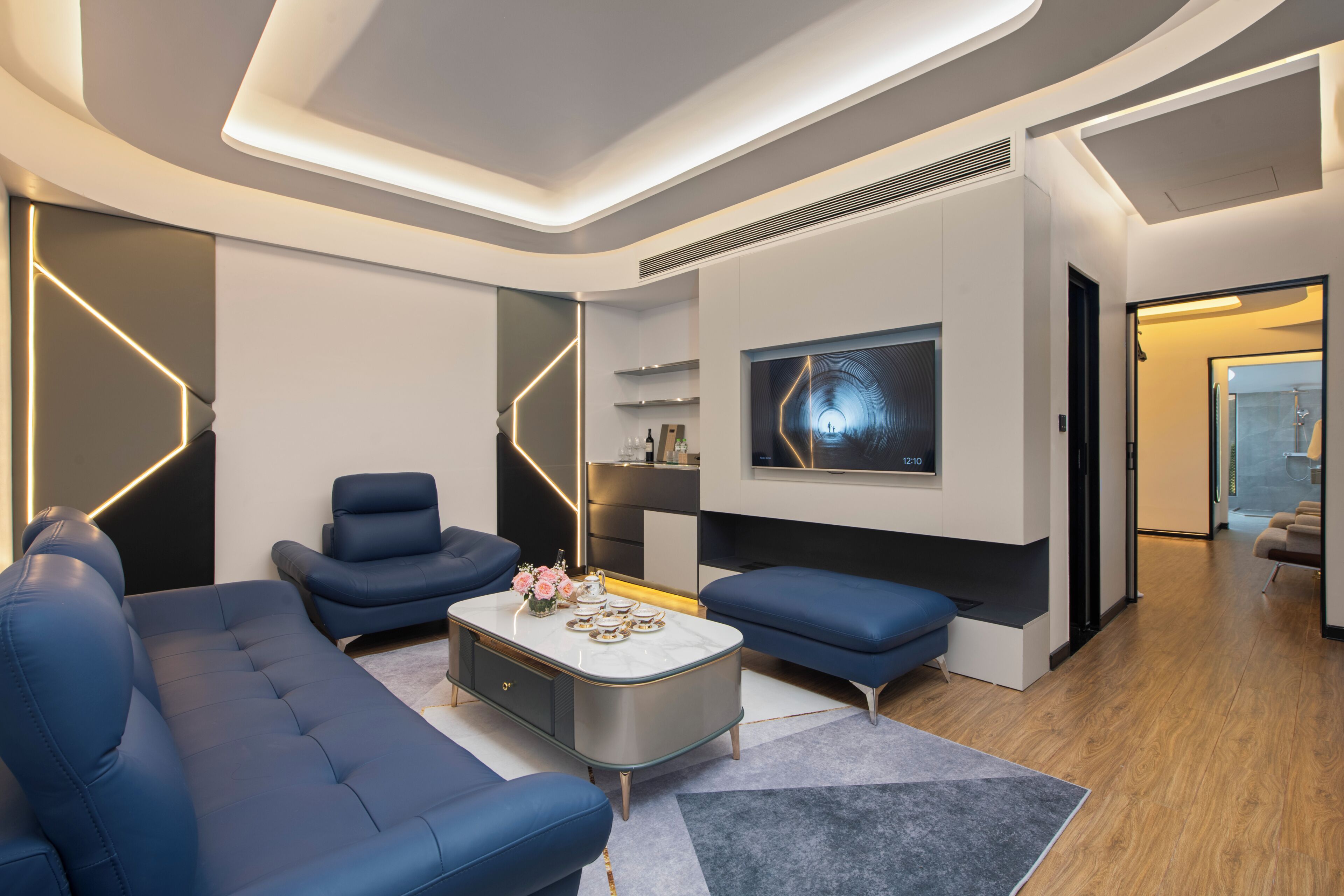 Deluxe Suite, 1 King Bed | Living area | 43-inch flat-screen TV with cable channels, TV