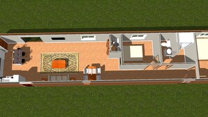 Plano de planta de una habitación de hotel con sala de estar, una pequeña cocina, baño y balcón.