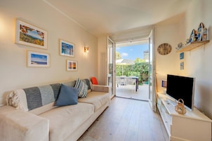 Family Apartment, Multiple Bedrooms, Mountainside (La Casa Accanto With Shared Pool) | Living area | 21-inch flat-screen TV with cable channels, stereo
