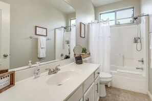 Combined shower/tub, hair dryer, towels, soap